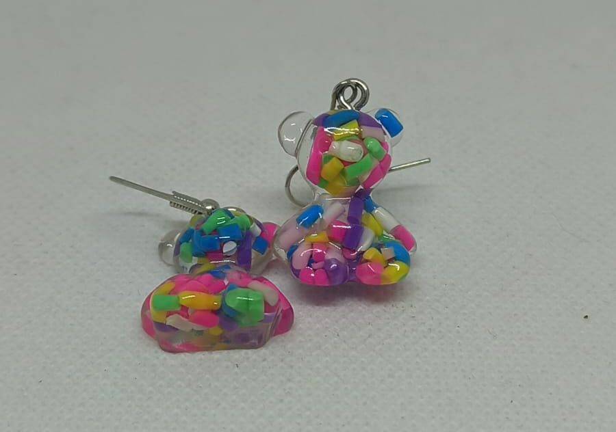 SP118 Aretes Tous acrilico lilas